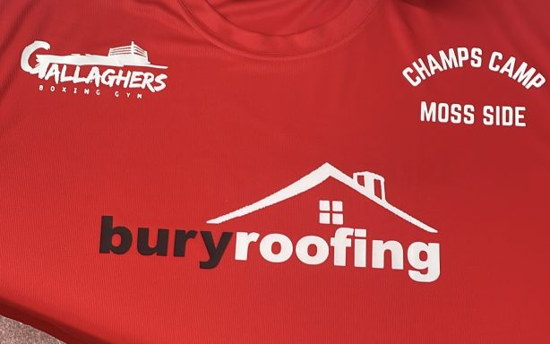 Red t-shirt featuring "buryroofing" and logos for Gallaghers and Champs Camp.